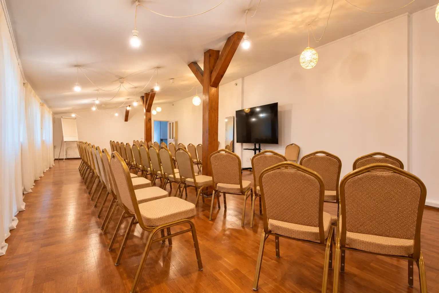 Large wooden meeting room with a projection screen